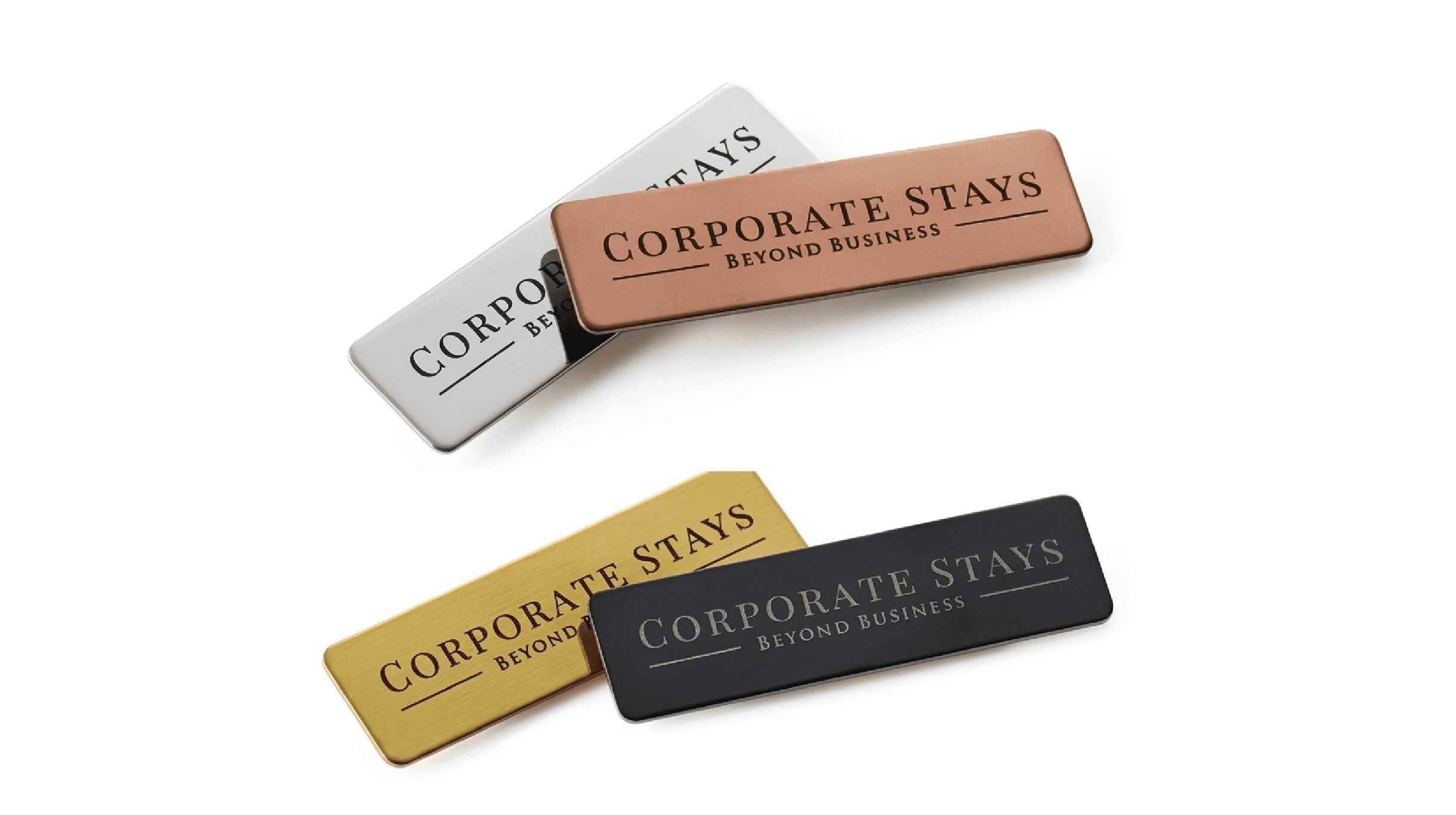 "Premium custom metal name badges branded with 'CORPORATE STAYS BEYOND BUSINESS' text, displayed in rose gold, silver, gold, and matte black finishes against a clean white background."