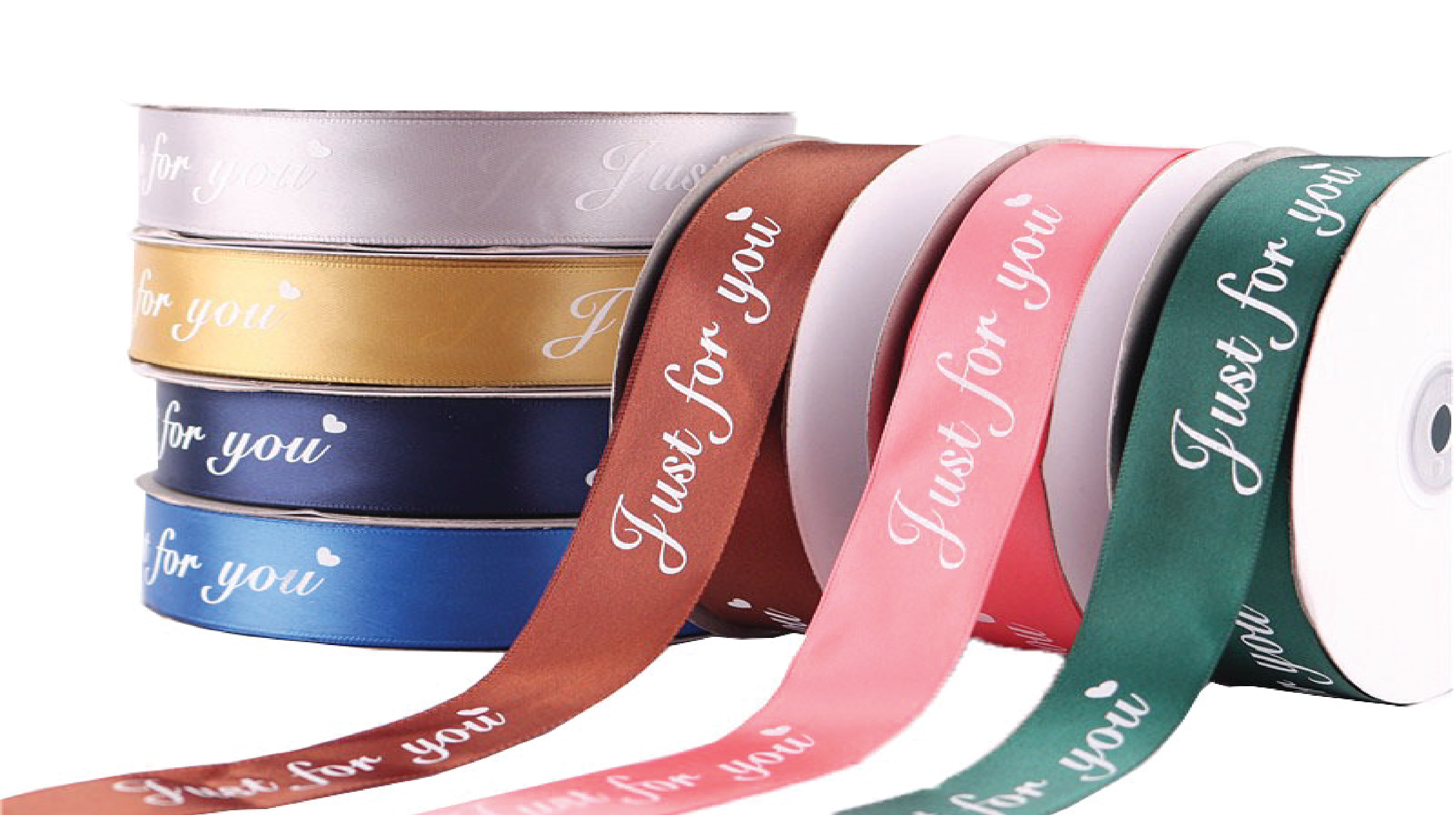 "Multiple rolls of premium satin gift ribbons customized with 'Just for you' text and a small heart, displayed in brown, pink, dark green, silver, gold, and royal blue colors."