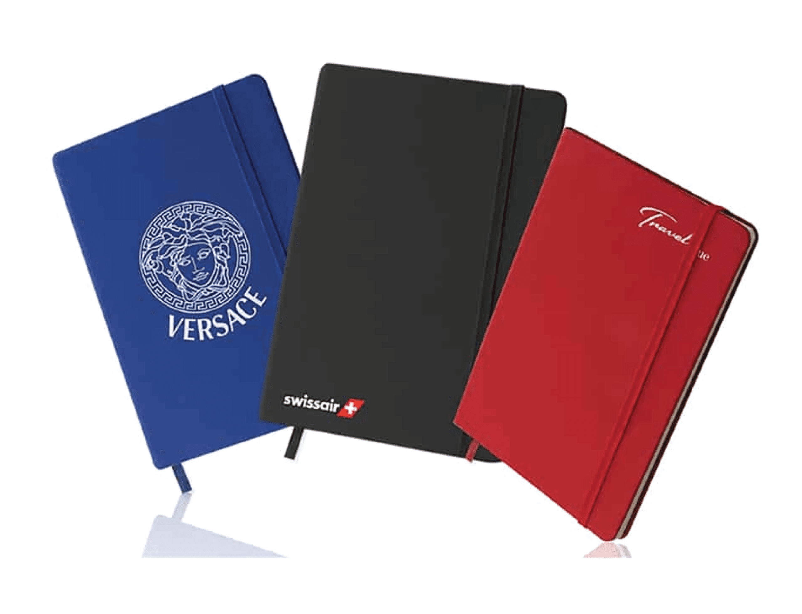 "Three custom printed hardcover corporate notebooks with elastic closure bands displayed in royal blue with a silver Versace logo, matte black with a Swissair logo, and solid red."